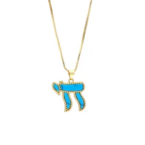 Gold box chain necklace with blue turquoise Hebrew Chai symbol pendant for women.