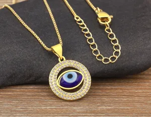 Gold plated evil eye necklace pendant with sparkling zirconia crystal detail close up view