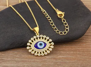 Detailed shot of gold plated evil eye pendant necklace with micro-inlaid cubic zirconia stones.
