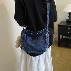Casual denim cross-body shoulder bag for women, large capacity daily commuting handbag.