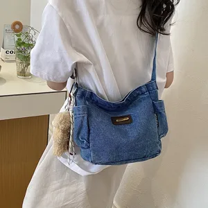 Casual denim crossbody bag for women, large capacity multi-pocket shoulder bag with charm.