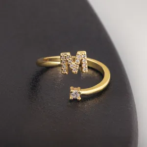 Gold plated minimalist letter M ring with sparkling cubic zirconia fashion jewelry.