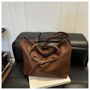 Casual solid brown leather tote bag for women, slouchy style large capacity shoulder handbag.
