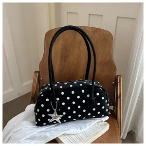 Black white polka dot shoulder pillow bag with double handles and star pendant for women.