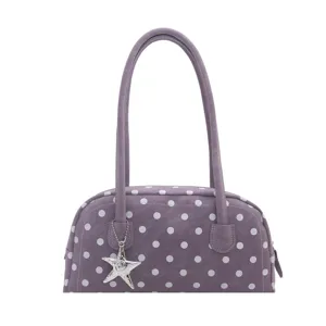 Stylish purple polka dot shoulder bag for women, trendy large capacity pillow bag with charm.