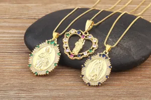 Gold plated religious saint and heart pendant necklace with colorful cubic zirconia details.