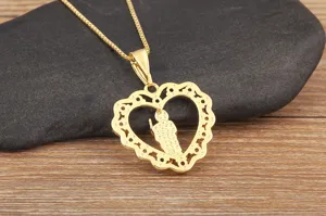 Detail of 18K gold plated heart necklace featuring grim reaper pendant with colorful zircons.