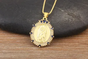 Gold plated Virgin Mary pendant necklace with blue and clear cubic zirconia stones for women.