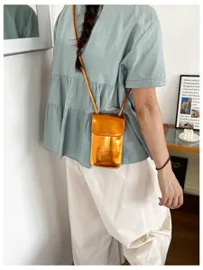Glossy mini vertical crossbody phone bag for women, stylish Korean style chic shoulder bag.