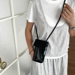 Black patent leather vertical mini crossbody phone bag for women, chic Korean style small shoulder bag