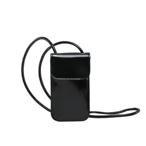 Black patent leather vertical phone bag for women, chic crossbody mini shoulder handbag.