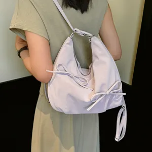 Casual slouchy pleated shoulder bag with cute bow detail, perfect for daily commuting use.