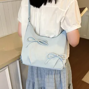 Light blue hobo shoulder bag featuring cute bowknot design, casual cloud style daily handbag.