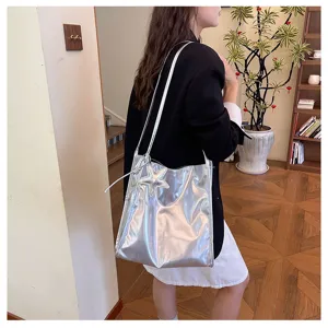 Large capacity silver metallic shoulder tote bag with star pendant for women commuting.