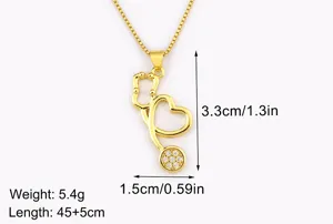 Gold plated stethoscope pendant necklace with sparkling cubic zirconia stones for daily wear.