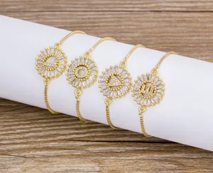 Close-up detail of gold plated letter bracelet featuring sparkling micro-set cubic zirconia.