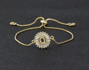 Gold plated letter O charm bracelet with shimmering micro set cubic zirconia adjustable length.