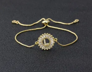 Close-up detail view of the gold-plated adjustable letter L zircon bracelet pendant.