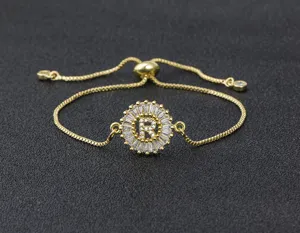 Gold plated adjustable letter R bracelet with sparkling cubic zirconia circular pendant jewelry.