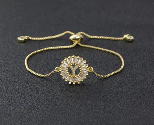 Detail shot of gold plated letter Y zircon adjustable slider bracelet sparkling stones.
