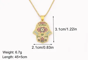 Detail shot of 18k gold plated Hamsa hand evil eye pendant necklace with multi-color cubic zirconia.