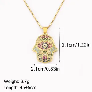 Gold plated Hamsa hand evil eye pendant necklace with colorful cubic zirconia stones.
