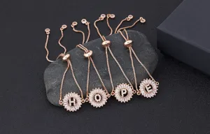 Rose gold plated initial letter charm bracelet with sparkling zircon stones and adjustable chain.