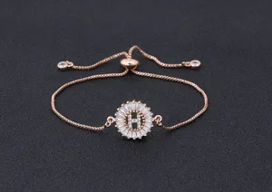 Close-up of a rose gold plated initial H adjustable slider bracelet with sparkling zirconia stones.