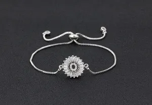 Close-up detail of the sparkling initial letter O rhinestone pendant on silver adjustable bracelet.