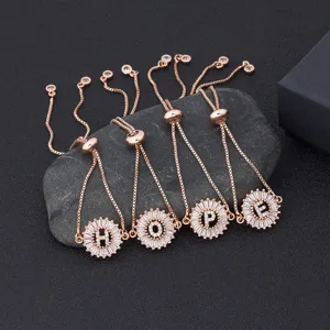 Rose gold adjustable initial letter bracelets set with shimmering micro-pave cubic zirconia stones.