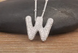 Exquisite micro-paved cubic zirconia letter W pendant necklace, detailed close-up shot.