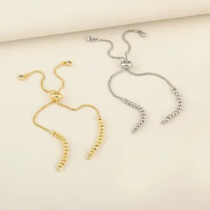 Adjustable sliding bead bracelet jewelry accessories, detail view of gold and silver chains.