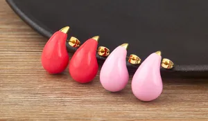 Close-up of candy color waterdrop enamel earrings with 18k gold plated finish to shine!