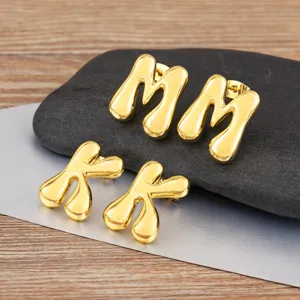Gold puffy letter M and K earrings, trendy minimalist alphabet stud earrings for women.