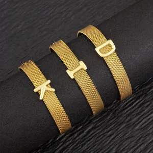 Gold-plated mesh alphabet bracelets featuring letter charms on a black display stand.