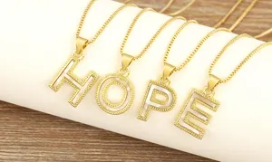Close-up of gold-plated letter HOPE necklaces with natural mother-of-pearl inlay and box chains.