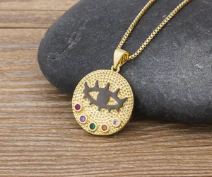 Detailed close-up view of the gold plated evil eye pendant necklace with colorful zirconia.