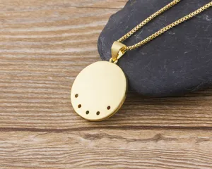 Close-up detail of 18k gold plated Turkish evil eye pendant necklace with colorful zircon stones.