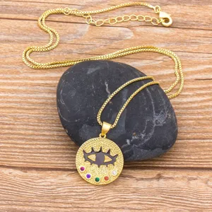 Gold-plated evil eye pendant necklace with colorful cubic zirconia and box chain design.