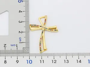 Gold plated colorful zirconia cross pendant jewelry detail shot showcasing elegant style.
