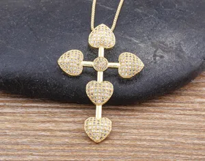 Gold plated cross pendant necklace with sparkling zirconia stones for women fashion jewelry.