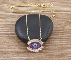 Turkish evil eye necklace for women, gold plated pendant with purple white zirconia stones.