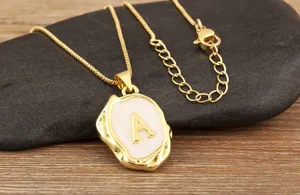 Gold plated irregular white enamel initial letter A pendant necklace with dainty box chain.