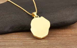 Gold plated irregular pendant necklace detail shot showcasing fine metallic texture on stone.
