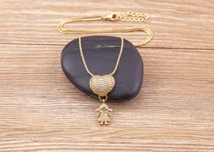Gold heart girl pendant necklace detailed shot showcasing paved zircon crystals on a delicate chain.