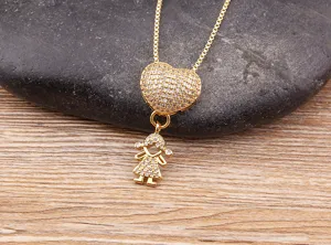 Detailed close-up shot of the sparkling cubic zirconia heart and girl pendant necklace.