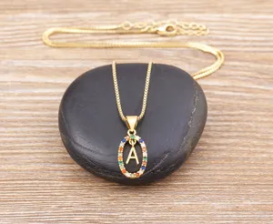 Gold-plated letter A pendant necklace detailed close-up featuring colorful cubic zirconia stones.