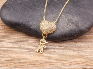 Gold paved heart necklace with cute boy pendant, exquisite detail jewelry for daily fashion wear.