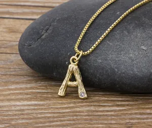 Gold 18k plated letter A initial pendant necklace featuring a sparkling crystal on box chain.