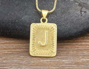 Gold-colored letter J pendant necklace featuring a textured rectangular frame in hip-hop style.